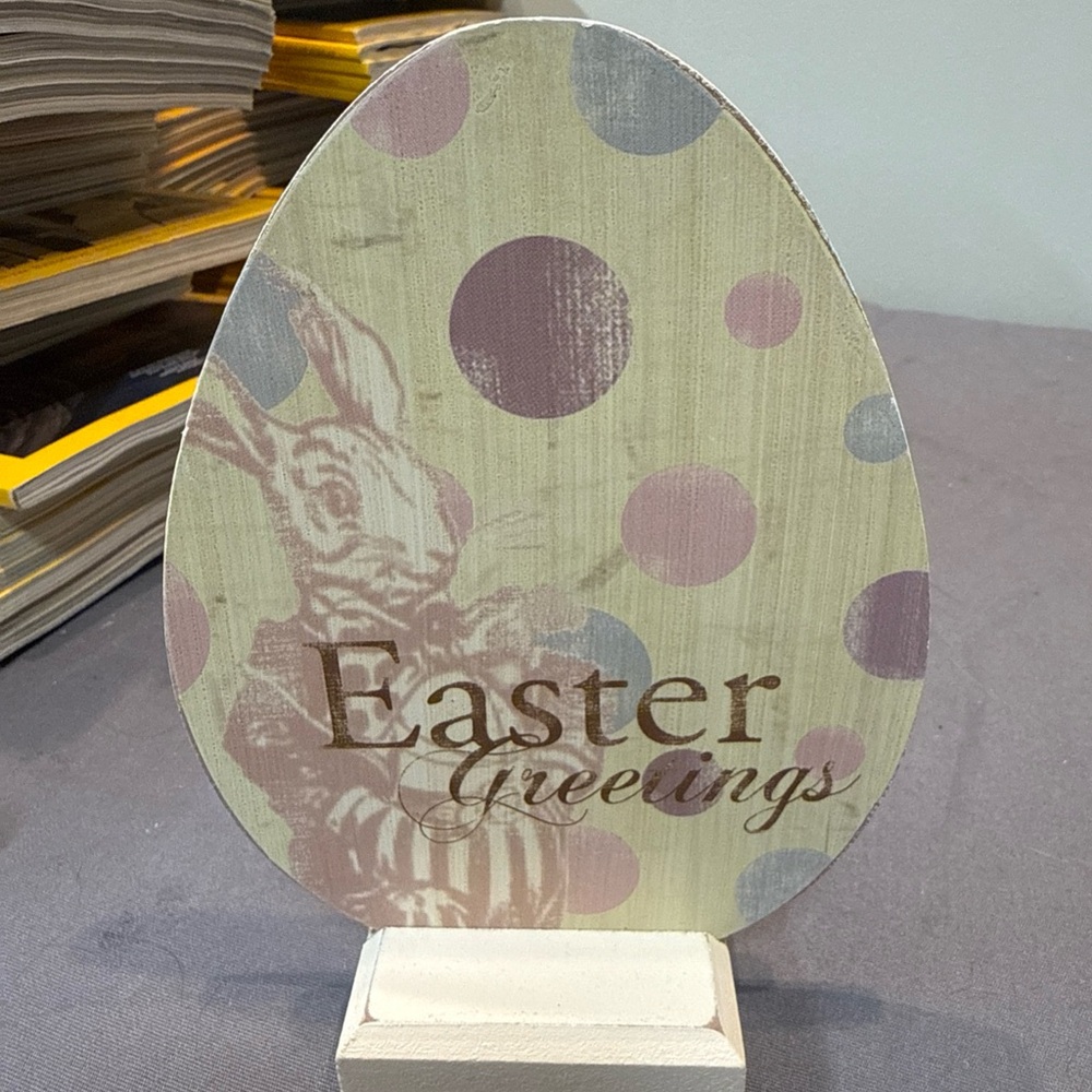 vintage easter greetings sign board with pastel and bunny